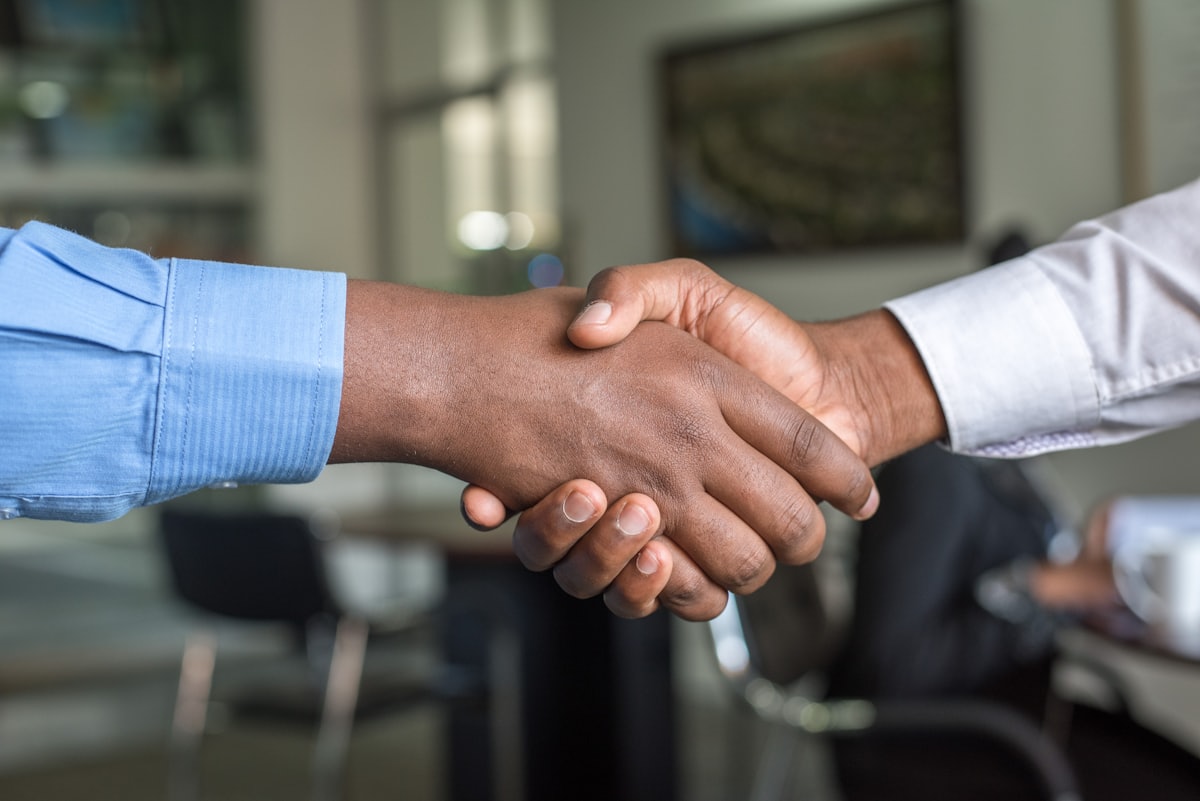 A helpful handshake representing support for clients